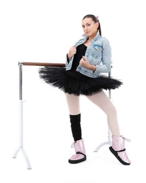 A skirt and leg warmer on top of a casual outfit